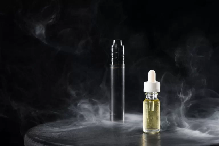 electronic-cigarette-and-liquid-with-clouds-of-smo-2021-08-29-19-41-04-utc-scaled